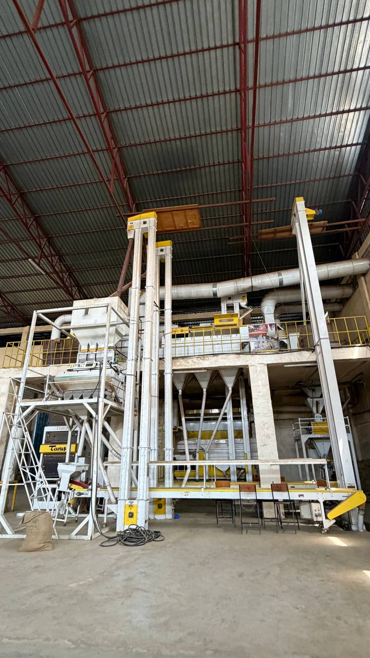 Coffee sorting and processing equipment inside a GMT Industrial PLC facility.